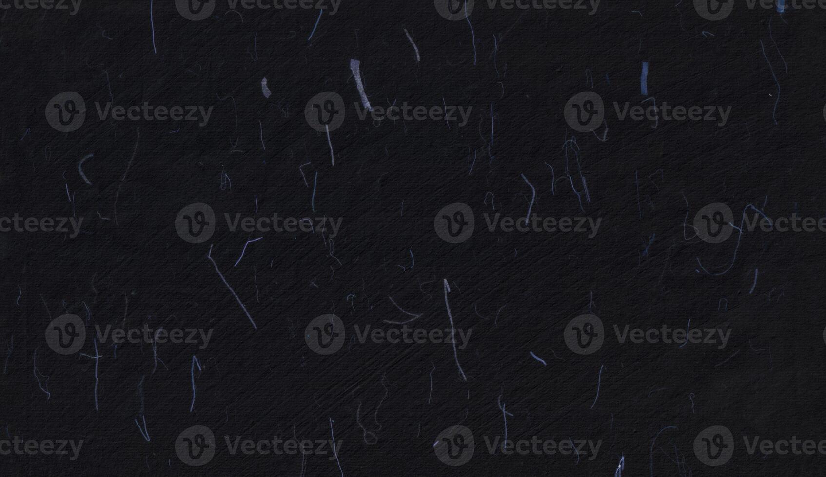 Handmade rice black paper texture with blue fibers for scrapbook. photo