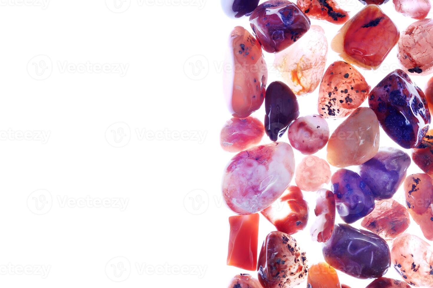 South onyx heap jewel stones texture on half white light isolated background. Place for text. photo