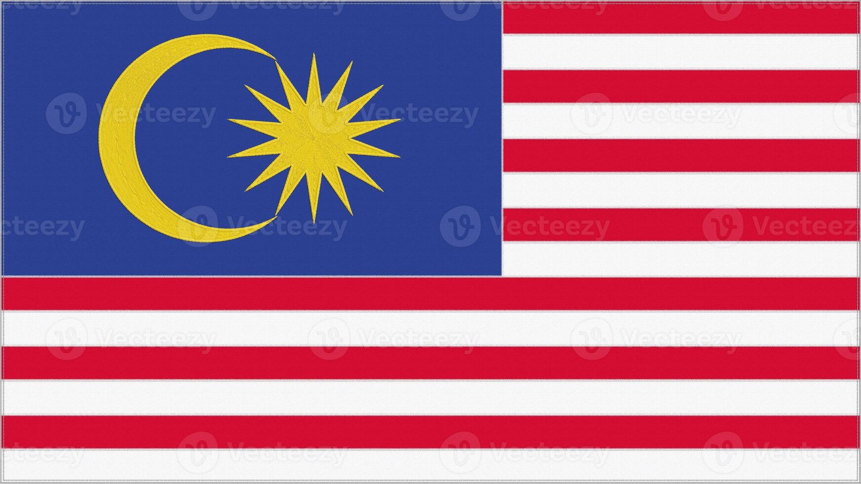 Malaysia embroidery flag. Malaysian emblem stitched fabric. Embroidered coat of arms. Country symbol textile background. photo