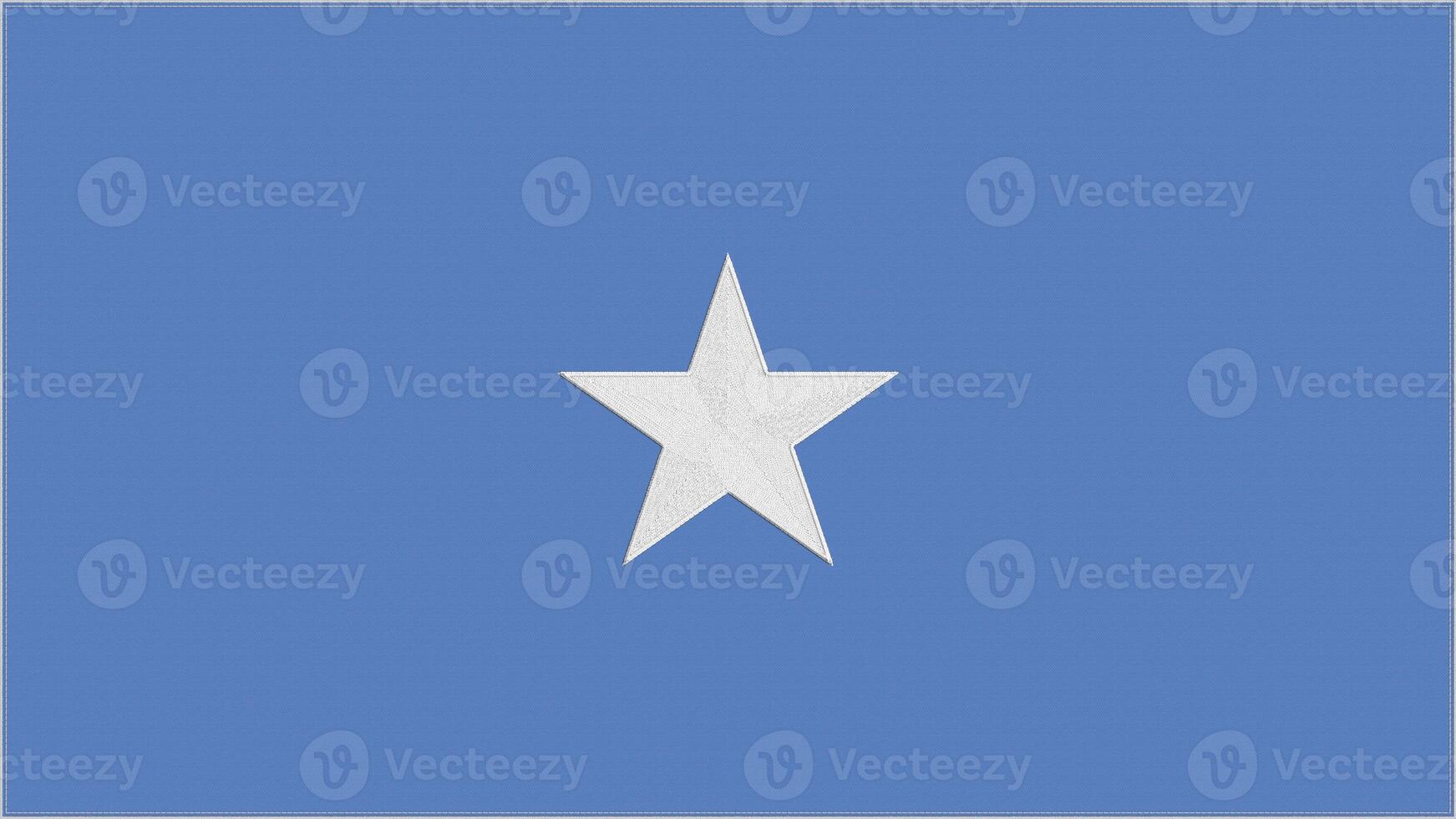 Somalia embroidery flag. Somali emblem stitched fabric. Embroidered coat of arms. Country symbol textile background. photo
