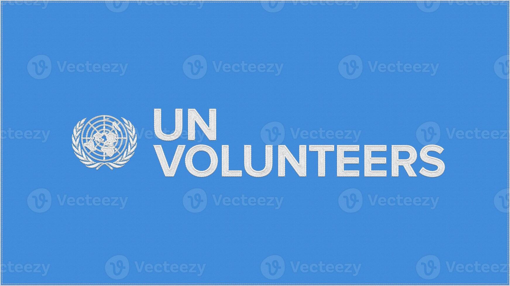 UNV - United Nations Volunteers embroidery flag. Emblem stitched fabric. Embroidered coat of arms. Country symbol textile background. photo
