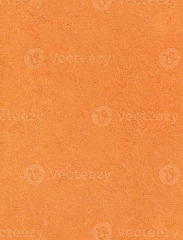 Seamless saffron paper texture. Plain Nepalese handmade lokta paper background. Vertical portrait orientation. photo