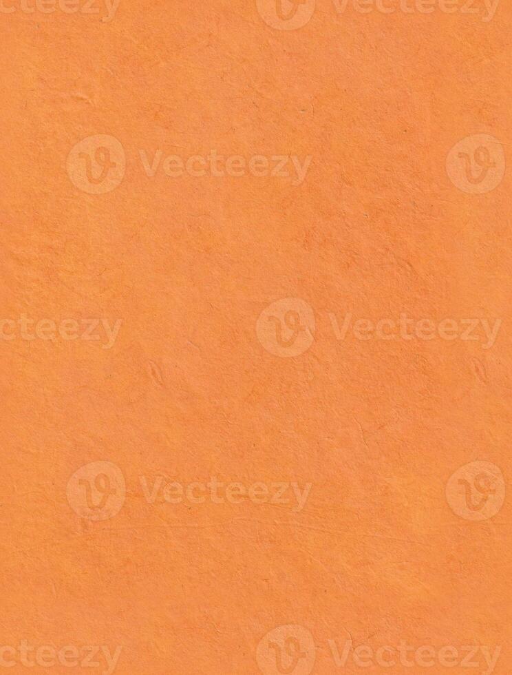 Seamless saffron paper texture. Plain Nepalese handmade lokta paper background. Vertical portrait orientation. photo
