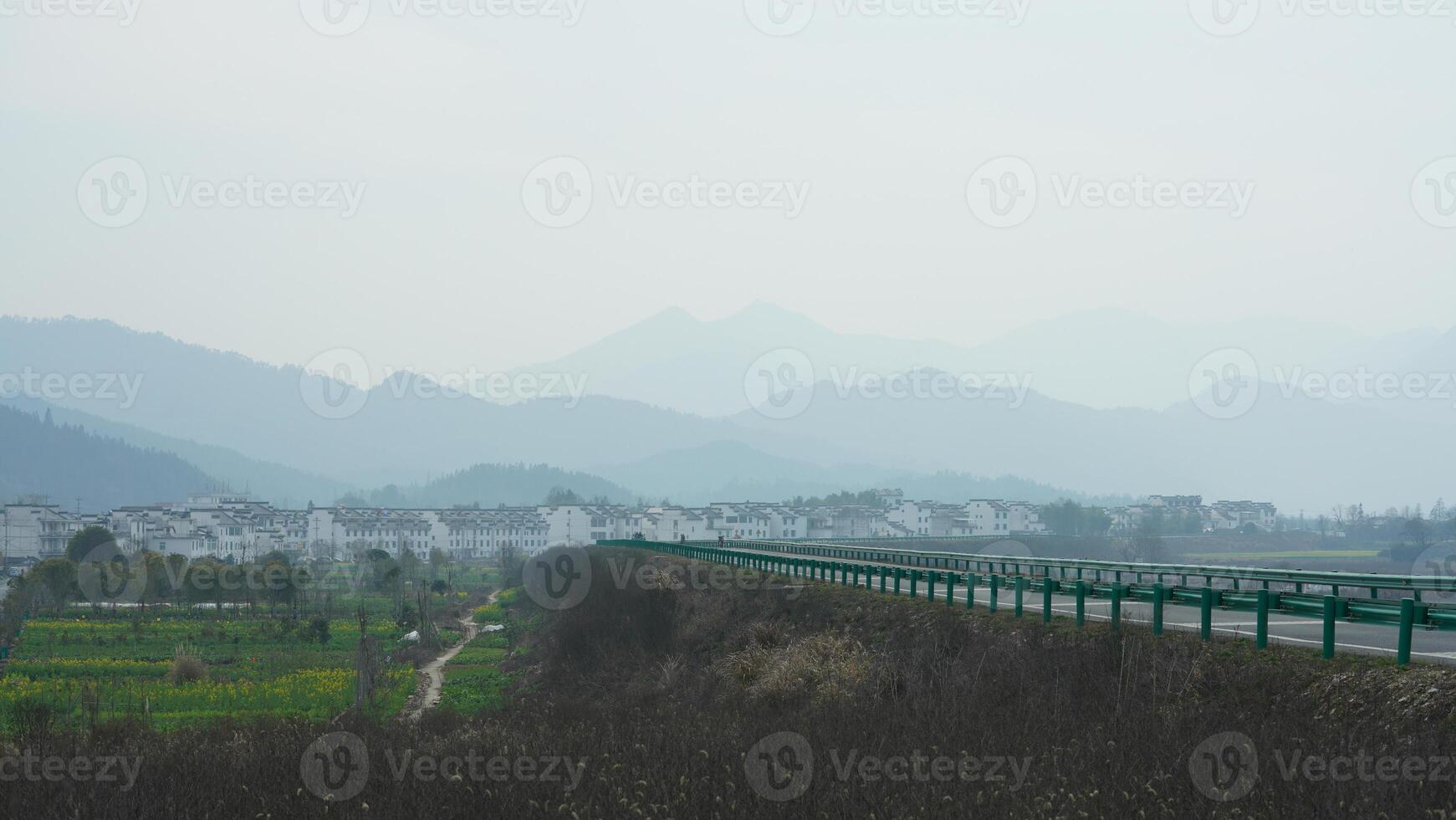 The beautiful mountains landscapes with the green forest and little village as background in the countryside of the China photo