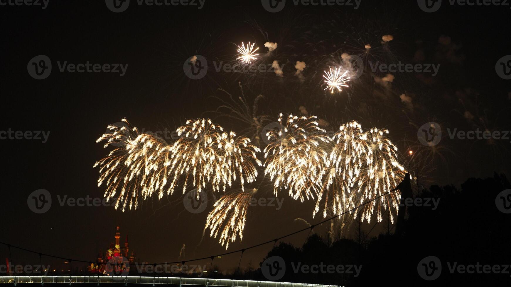 The colorful and beautiful fireworks show with the dark sky as background at night photo