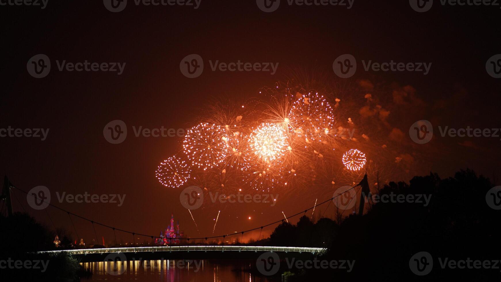 The colorful and beautiful fireworks show with the dark sky as background at night photo