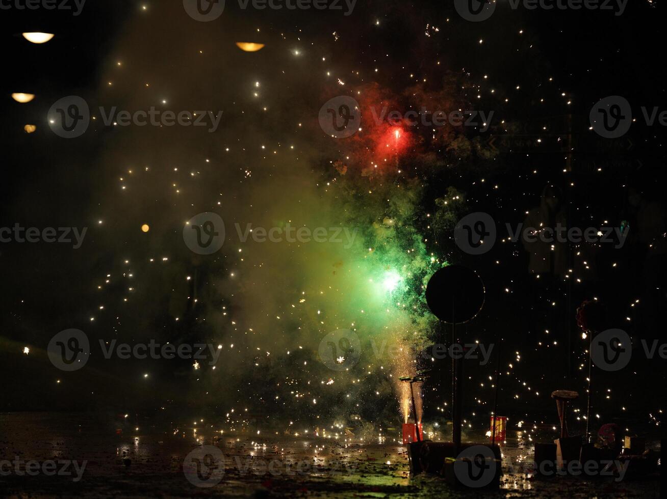 The colorful and beautiful fireworks show with the dark sky as background at night photo