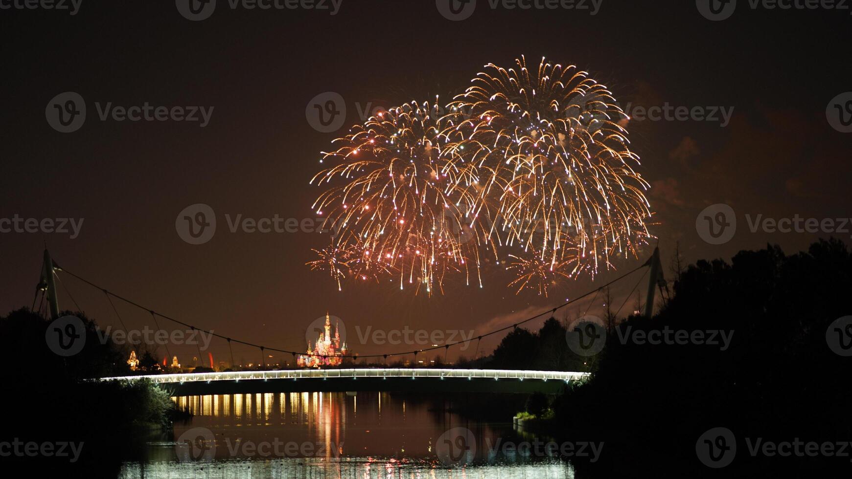 The colorful and beautiful fireworks show with the dark sky as background at night photo