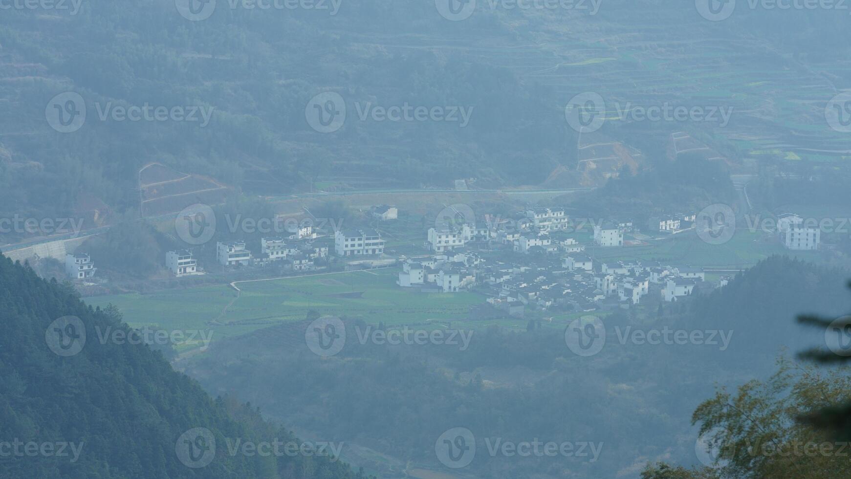 The beautiful mountains landscapes with the green forest and little village as background in the countryside of the China photo