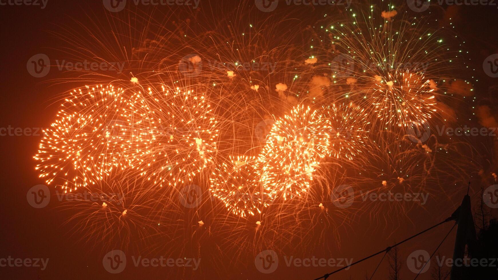 The colorful and beautiful fireworks show with the dark sky as background at night photo