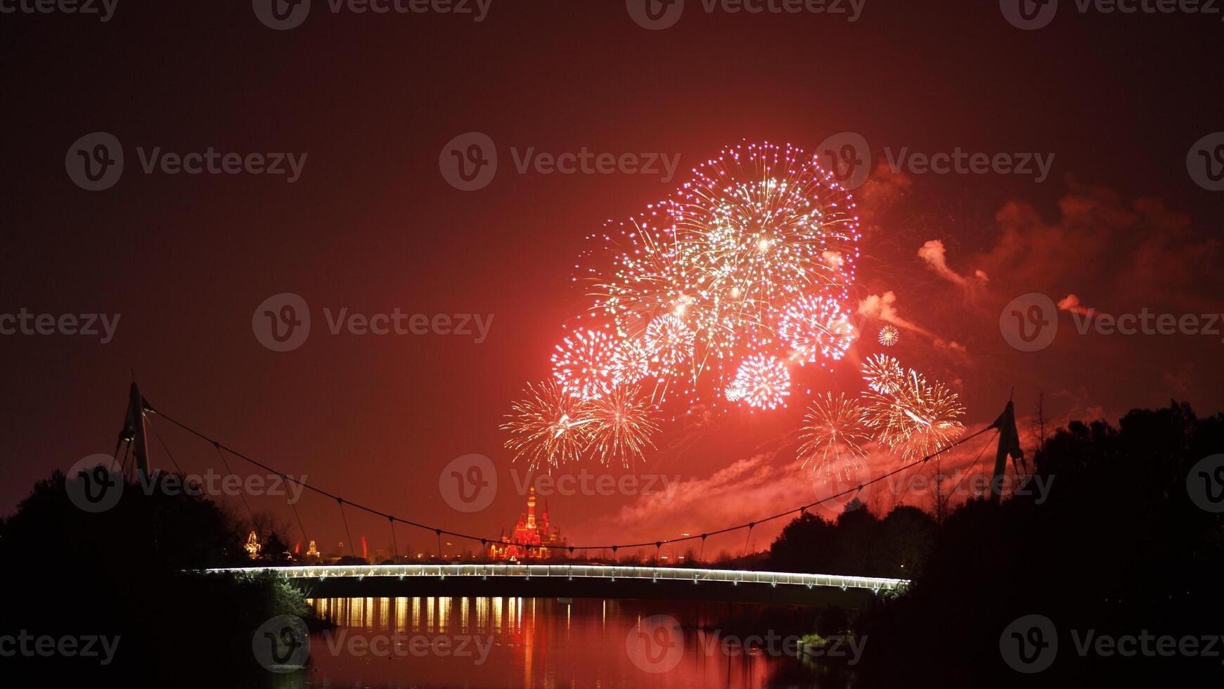 The colorful and beautiful fireworks show with the dark sky as background at night photo