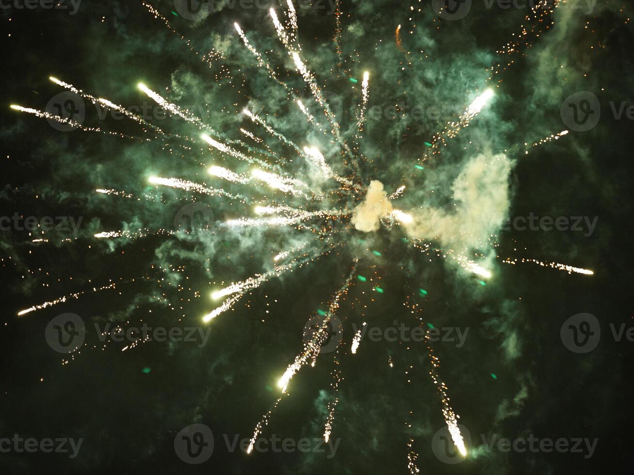 The colorful and beautiful fireworks show with the dark sky as background at night photo
