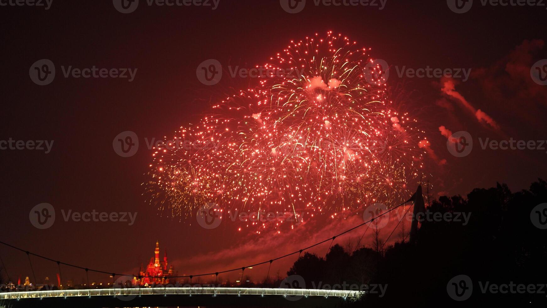 The colorful and beautiful fireworks show with the dark sky as background at night photo