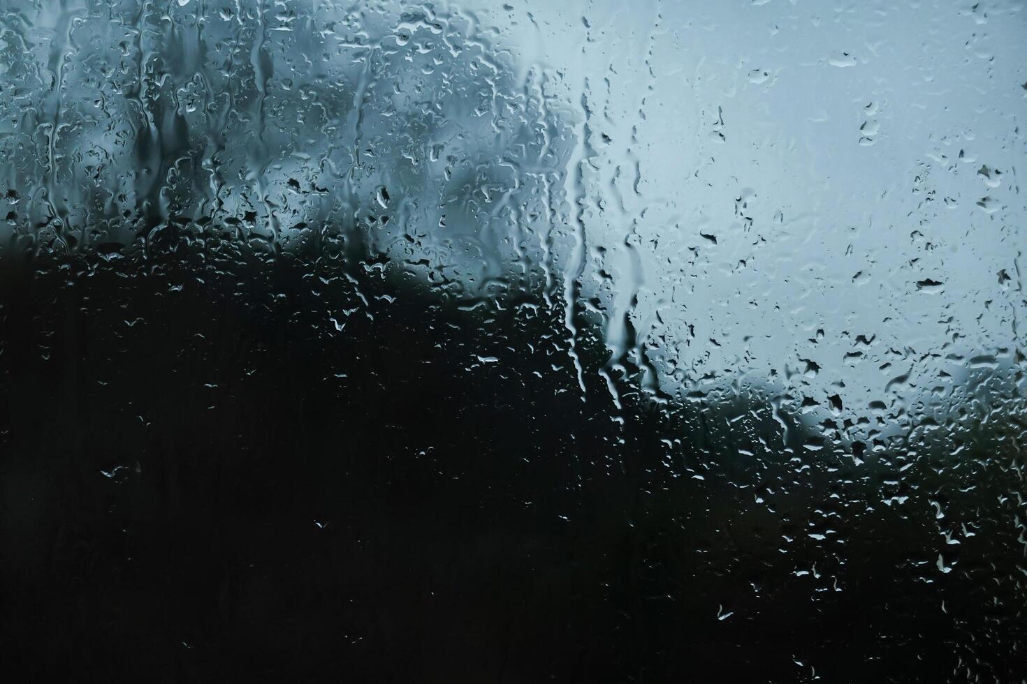Window Rain, A serene blend of water and glass, Raindrops on Abstract Textured Glass photo