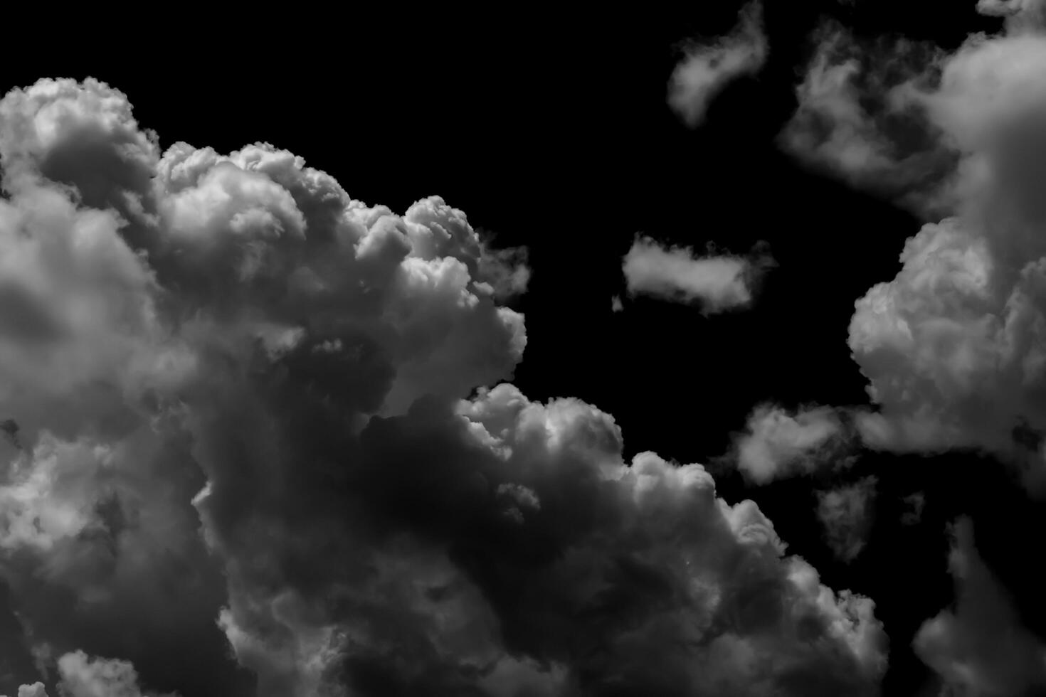 Separate white clouds on a black background have real clouds. White clouds isolated on a black background are realistic clouds, Smoke explosions abstract clouds photo