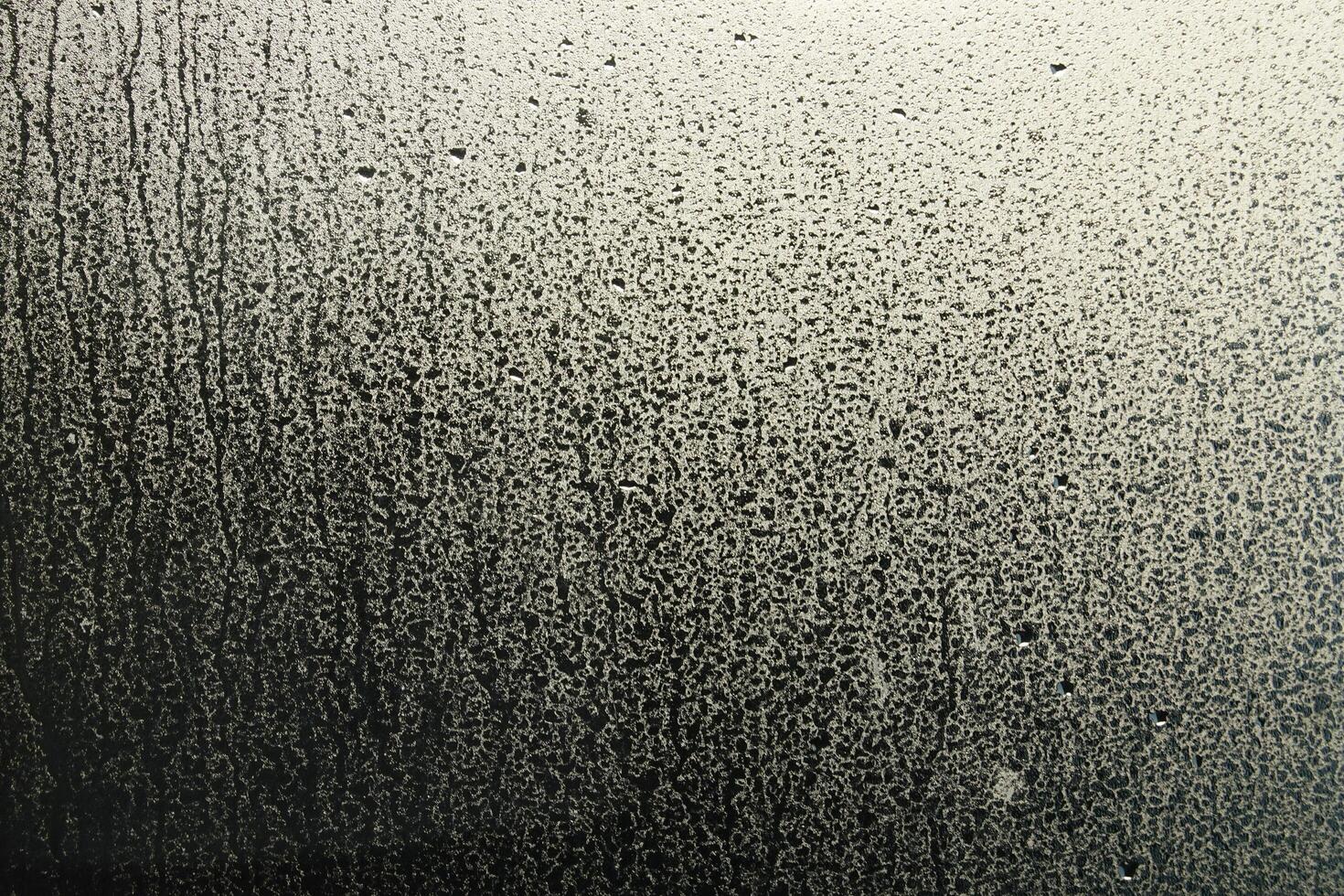 Window Rain, A serene blend of water and glass, Raindrops on Abstract Textured Glass photo