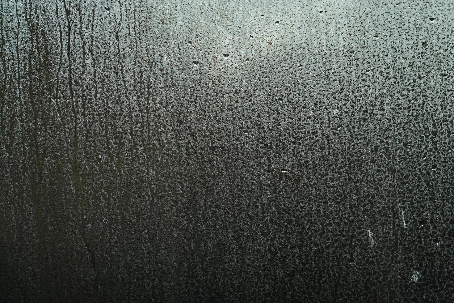 Window Rain, A serene blend of water and glass, Raindrops on Abstract Textured Glass photo