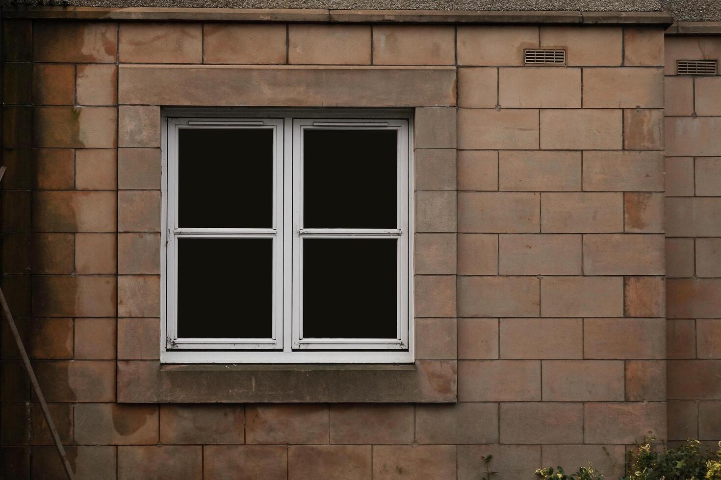 Vintage Window Embedded in Stone Wall of an Ancient House photo