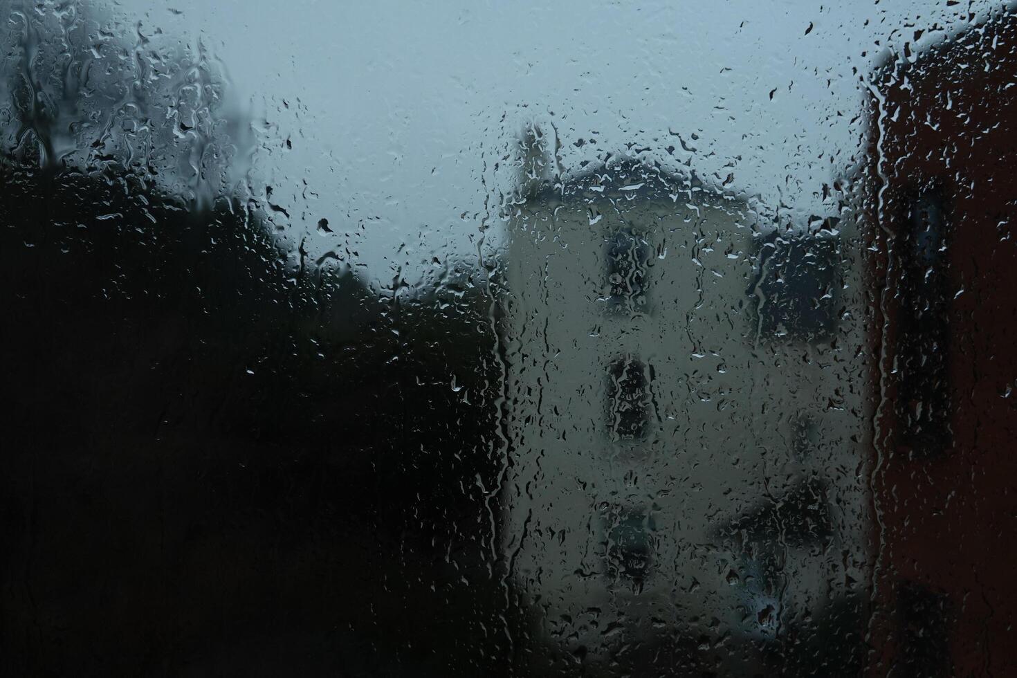 Window Rain, A serene blend of water and glass, Raindrops on Abstract Textured Glass photo