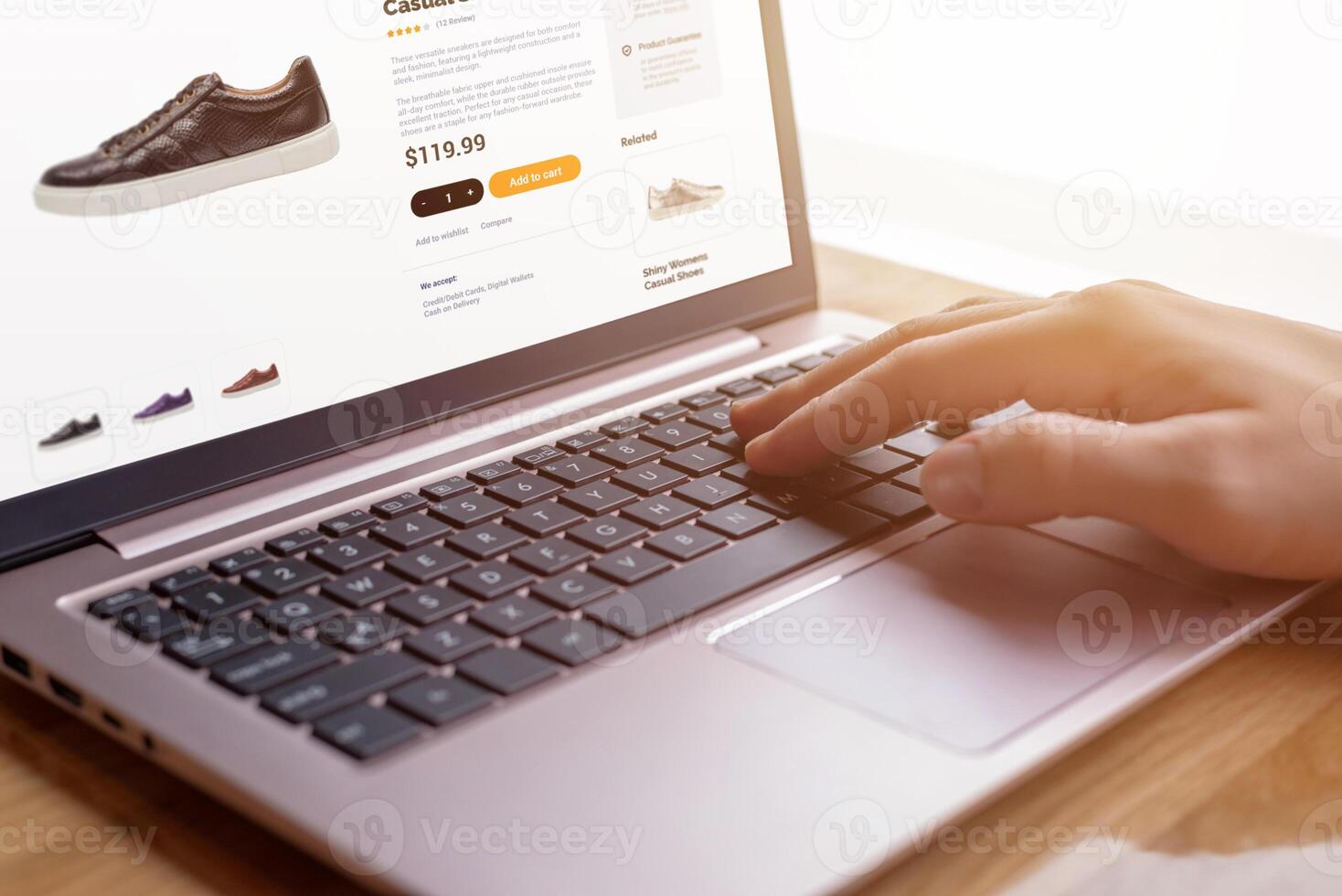 Hands on keyboard searching for modern shoes. E-commerce interface concept. Seamless digital shopping experience for shoe enthusiasts photo