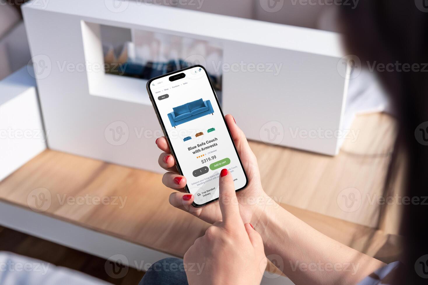 Woman purchases blue sofa online via smartphone from living room, showcasing modern ecommerce app and intuitive user interface design photo
