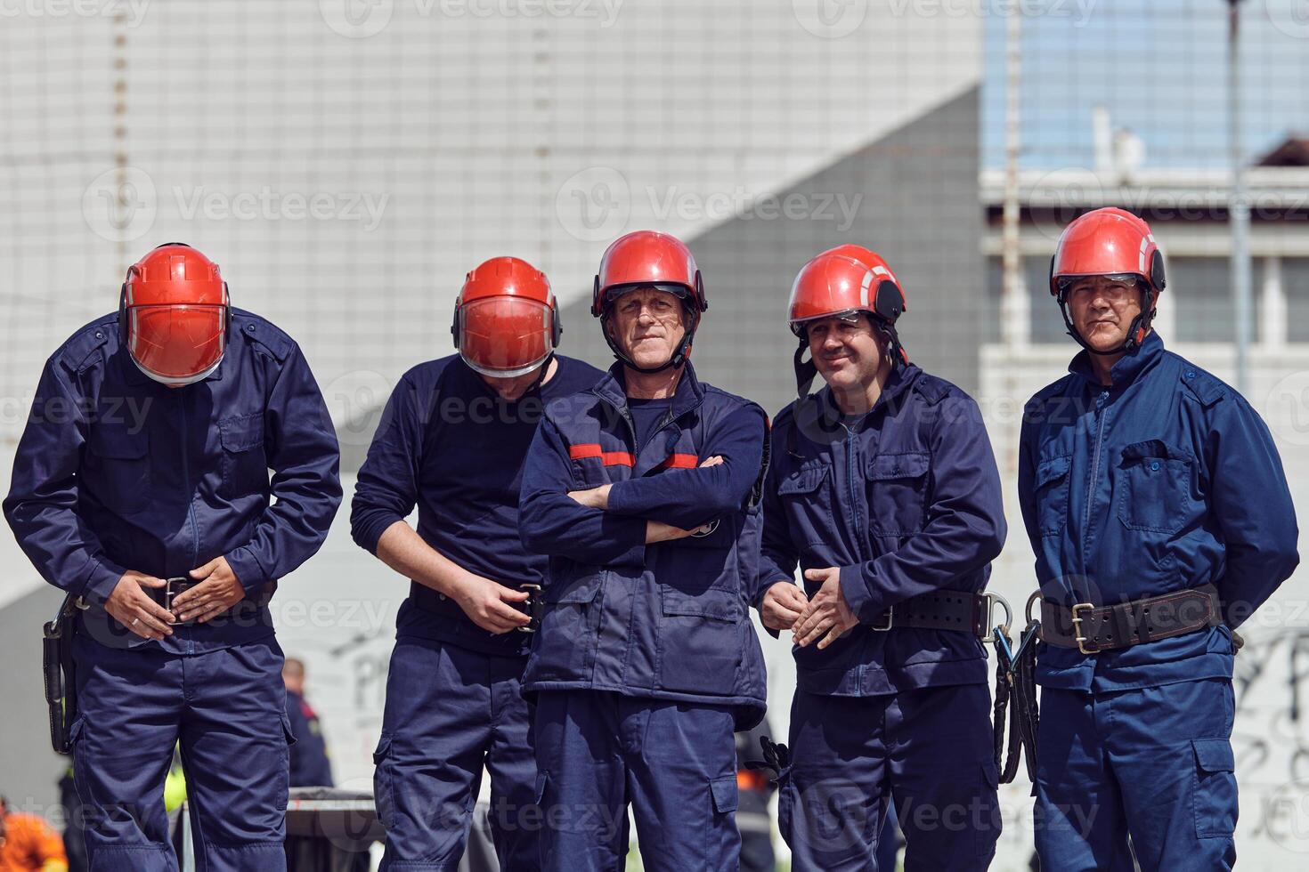 A team of confident and accomplished firefighters strides purposefully in their uniforms, exuding pride and satisfaction after successfully completing a challenging firefighting mission photo