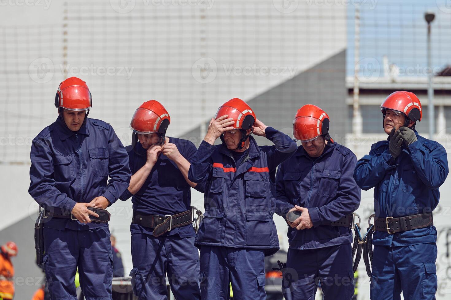 A team of confident and accomplished firefighters strides purposefully in their uniforms, exuding pride and satisfaction after successfully completing a challenging firefighting mission photo