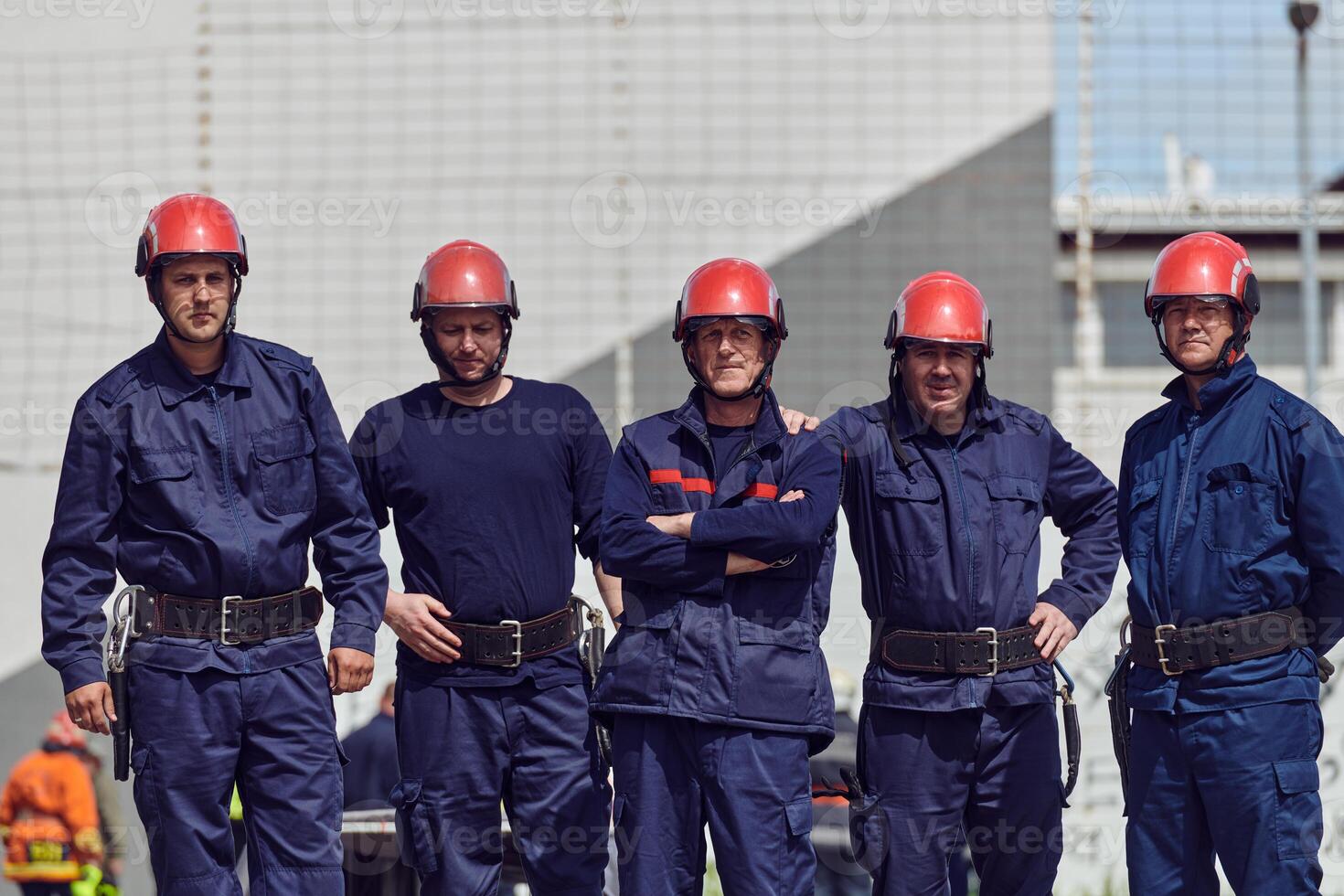 A team of confident and accomplished firefighters strides purposefully in their uniforms, exuding pride and satisfaction after successfully completing a challenging firefighting mission photo