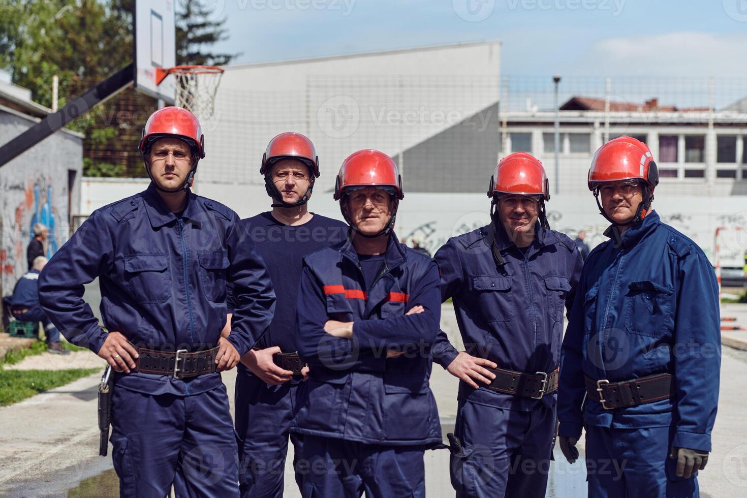 A team of confident and accomplished firefighters strides purposefully in their uniforms, exuding pride and satisfaction after successfully completing a challenging firefighting mission photo