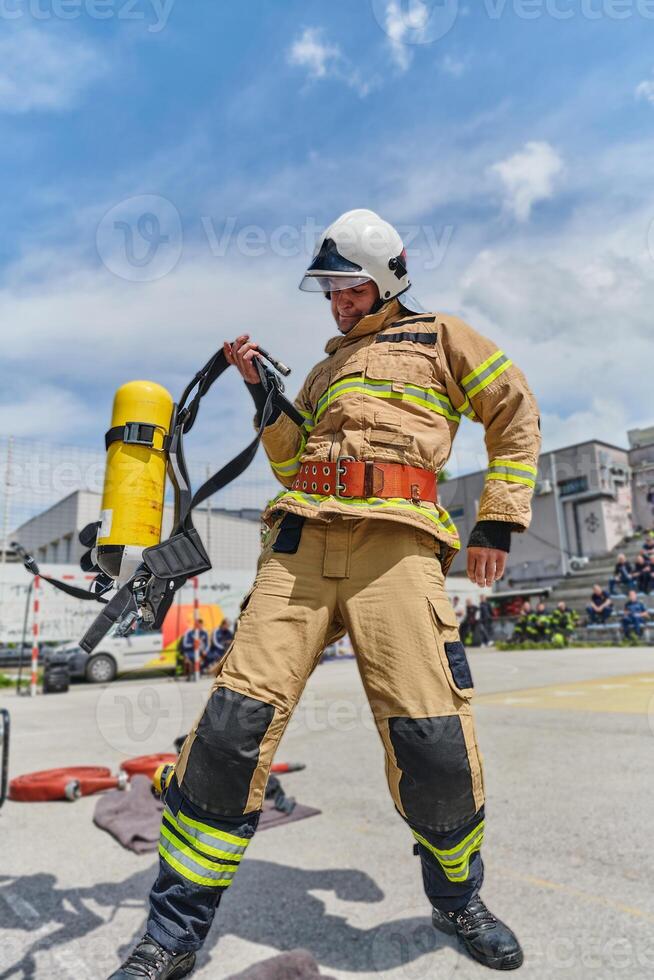 A firefighter dons the essential components of their professional gear, embodying resilience, commitment, and readiness as they gear up for a hazardous firefighting mission, a testament to their photo