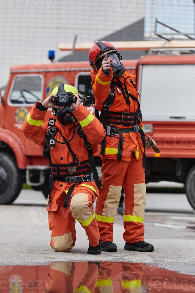 Firefighter Team Learning Thermal Camera Usage During Training Session photo