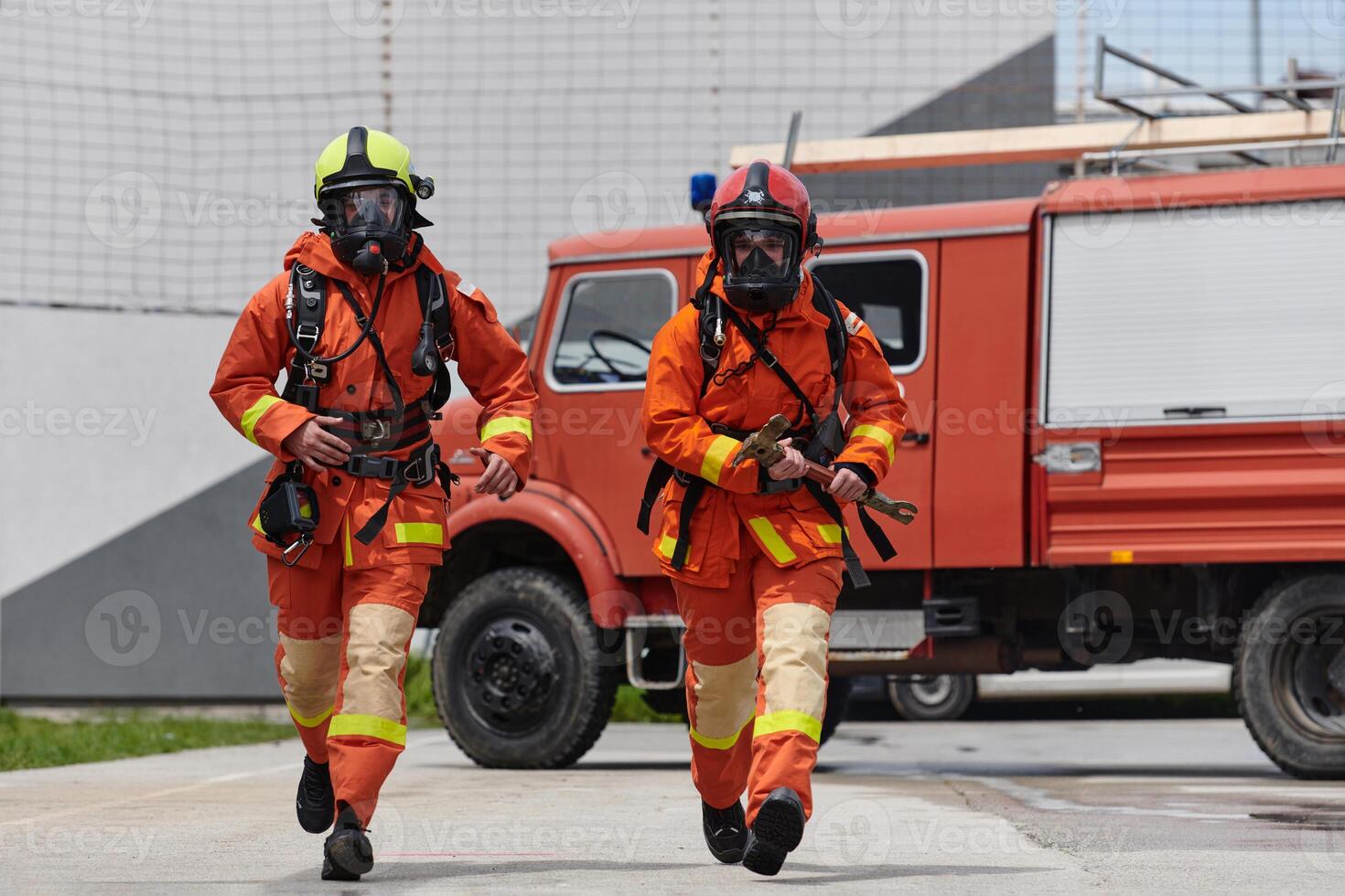 Firefighter Team Training with Various Tools in Professional Gear photo