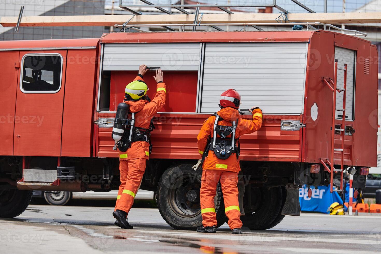 Firefighter Team Training with Various Tools in Professional Gear photo