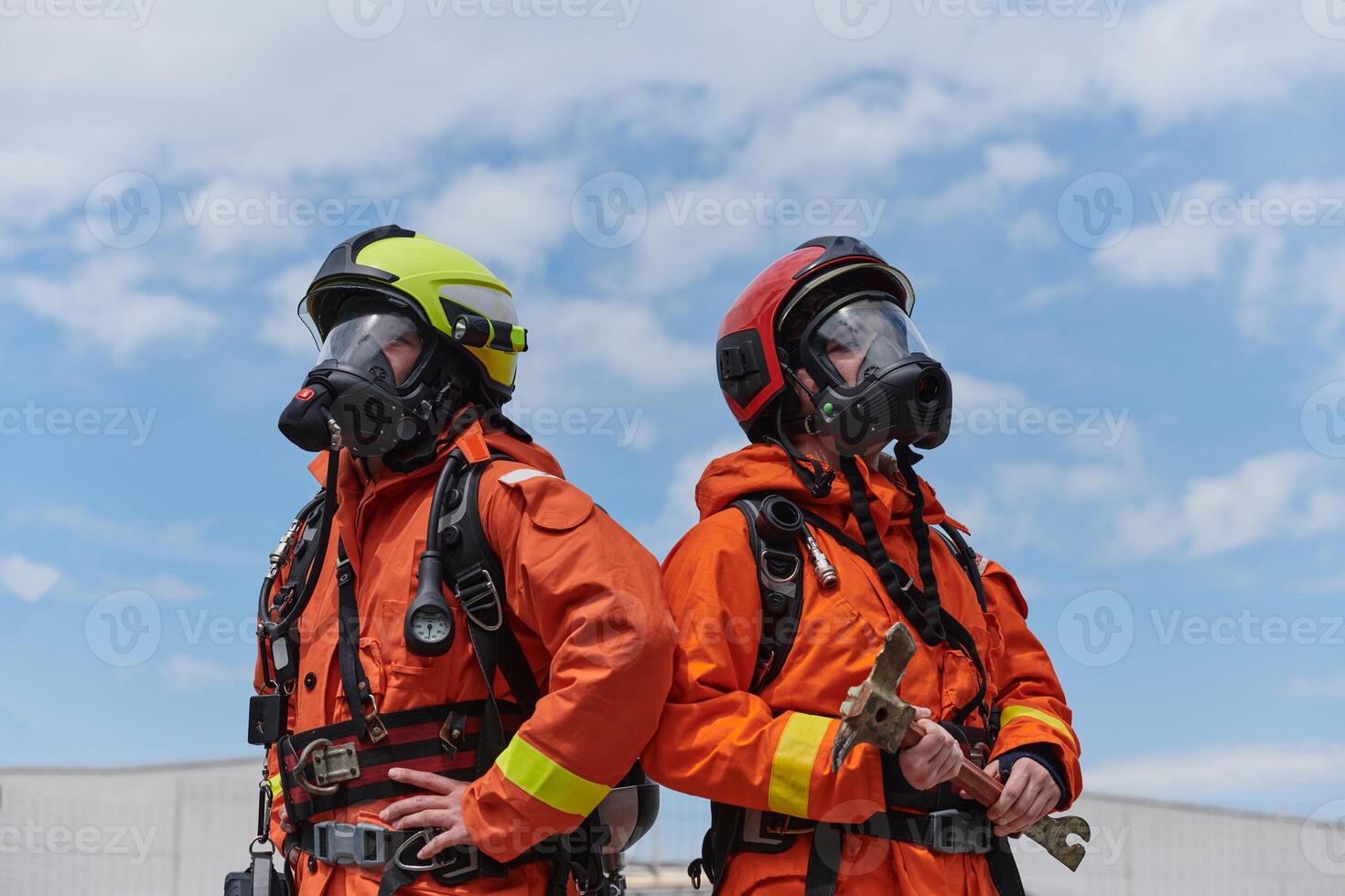 Firefighter Team Training with Various Tools in Professional Gear photo
