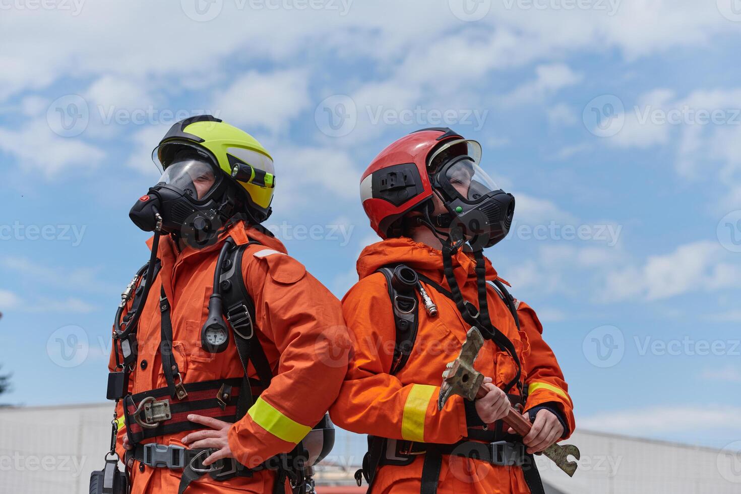 Firefighter Team Training with Various Tools in Professional Gear photo