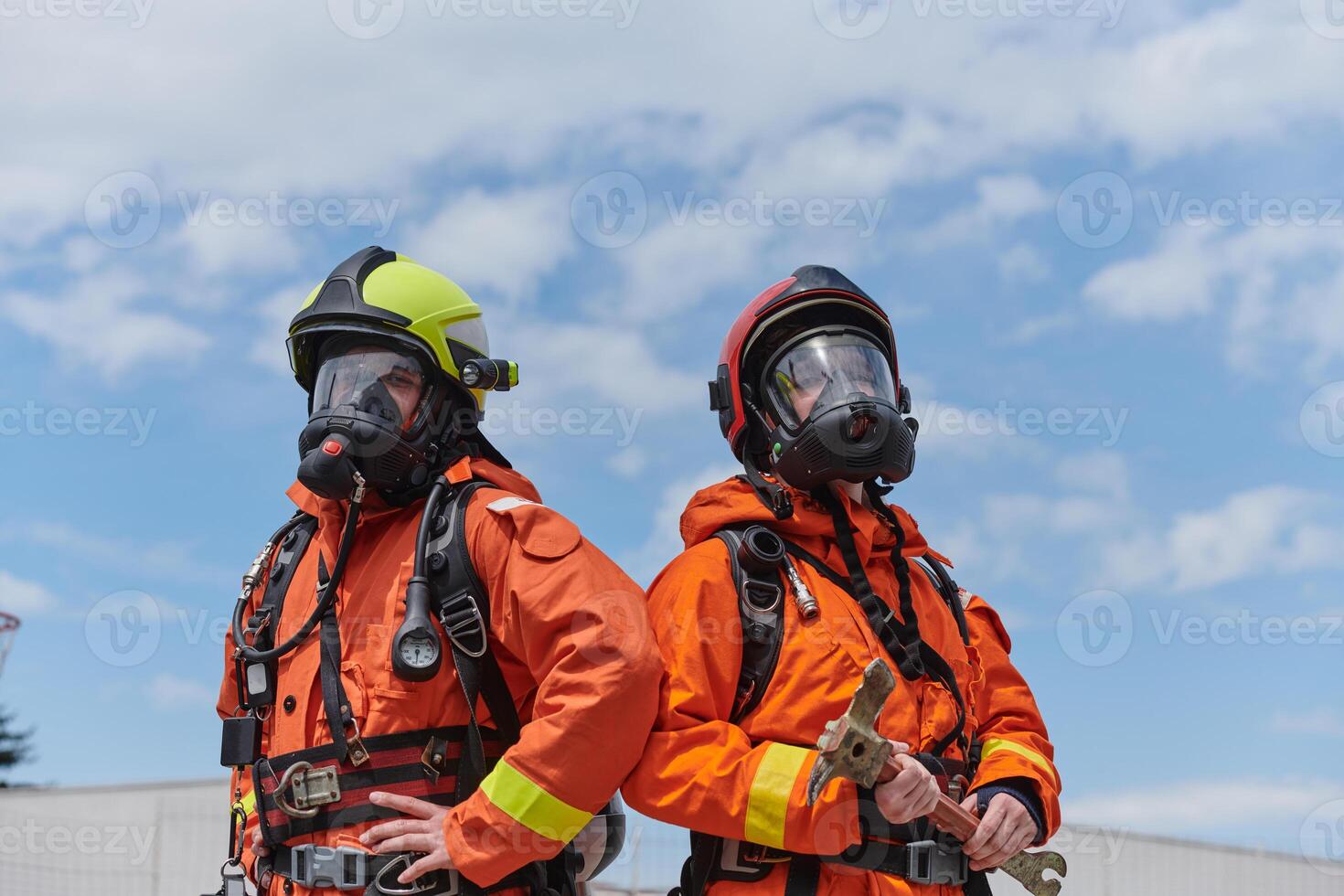 Firefighter Team Training with Various Tools in Professional Gear photo