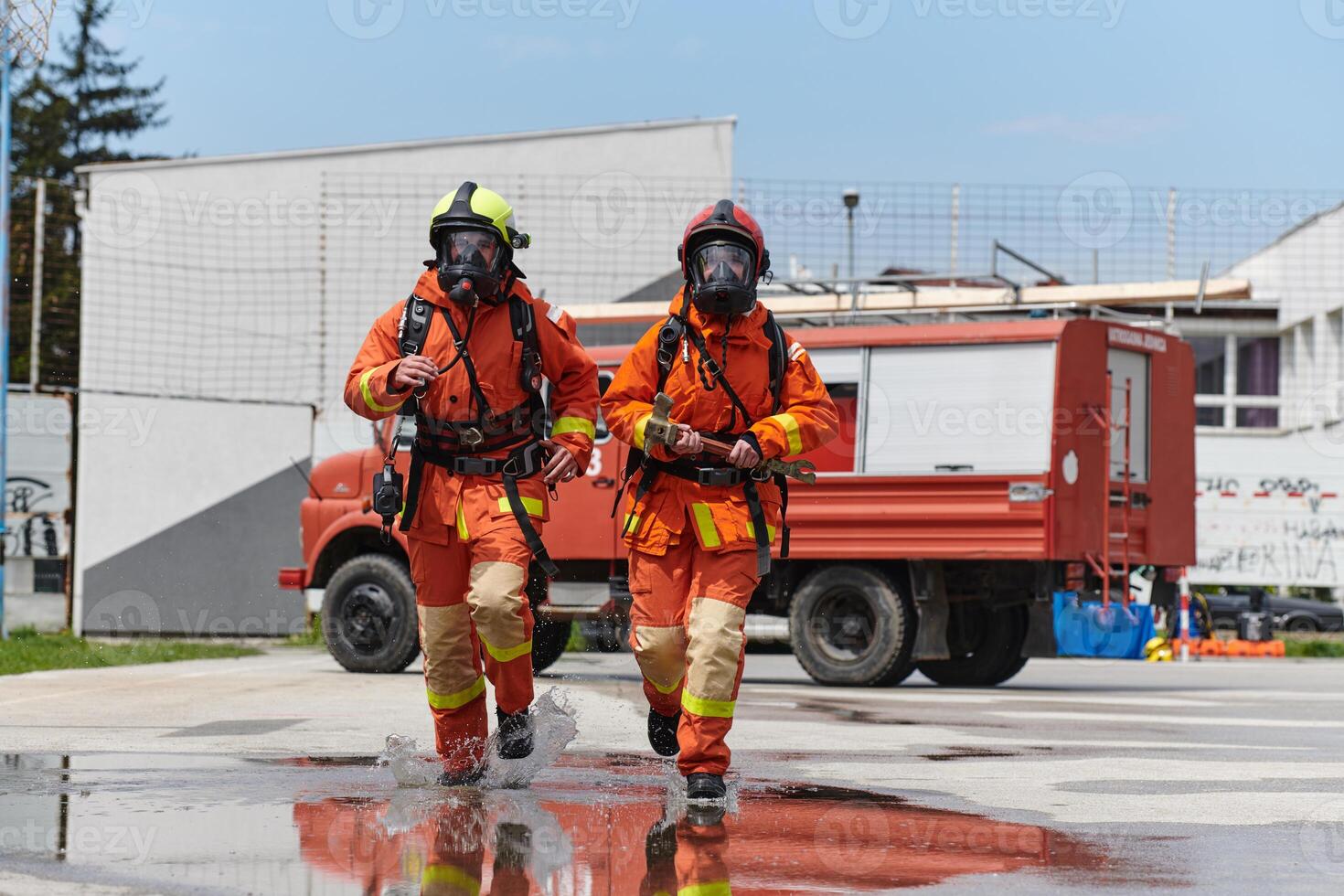 A team of confident and accomplished firefighters strides purposefully in their uniforms, exuding pride and satisfaction after successfully completing a challenging firefighting mission photo