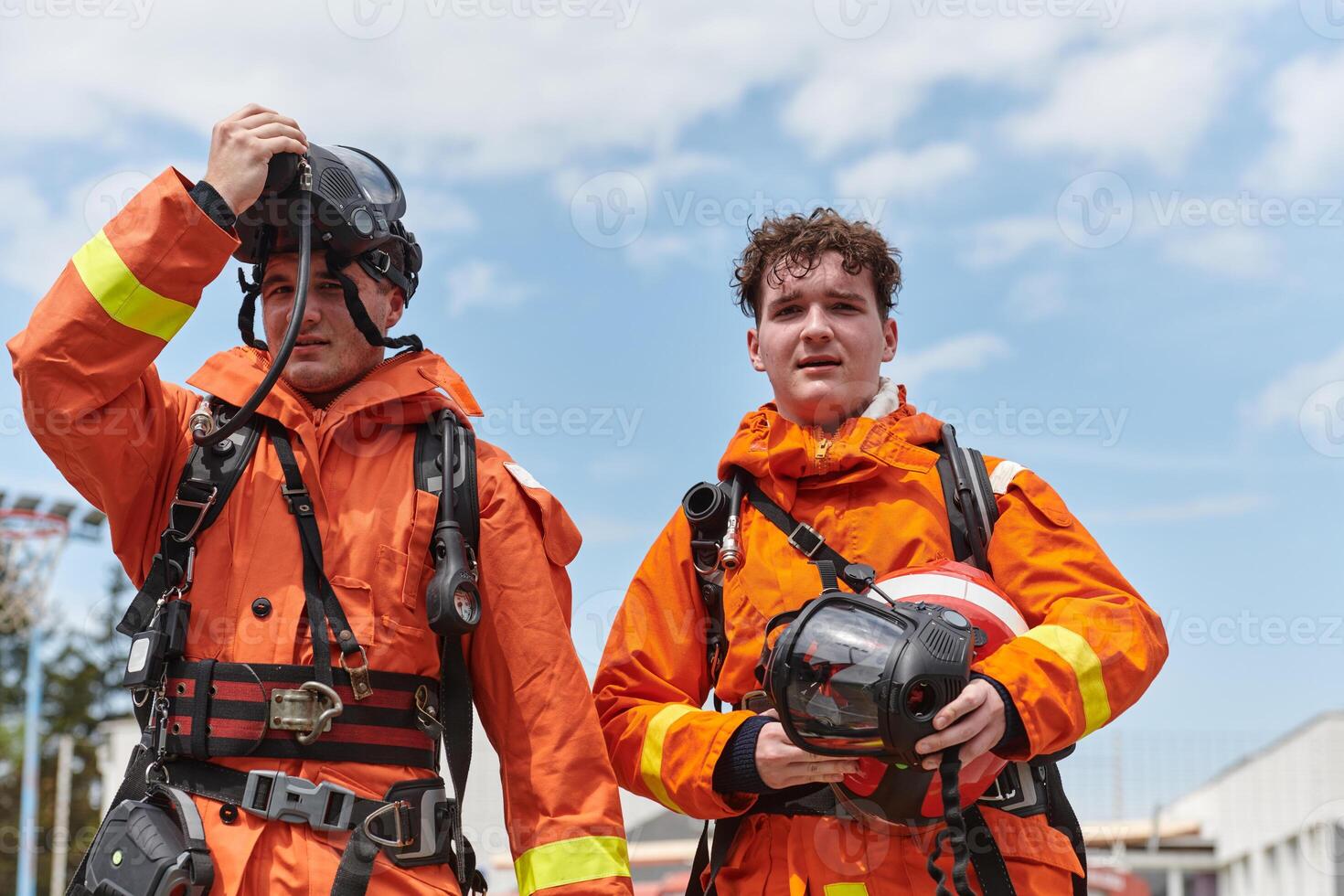 A team of confident and accomplished firefighters strides purposefully in their uniforms, exuding pride and satisfaction after successfully completing a challenging firefighting mission photo