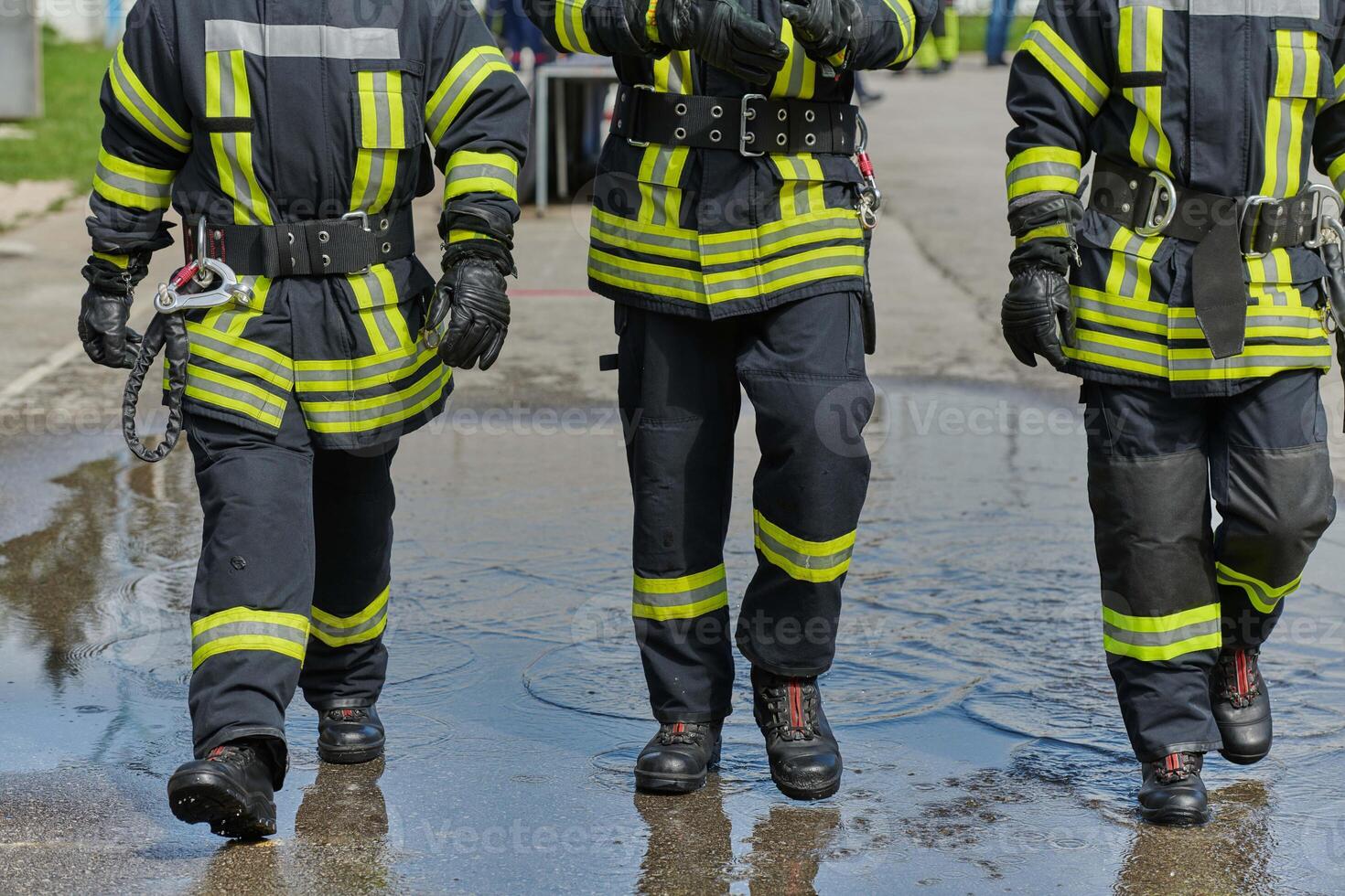 A team of confident and accomplished firefighters strides purposefully in their uniforms, exuding pride and satisfaction after successfully completing a challenging firefighting mission photo