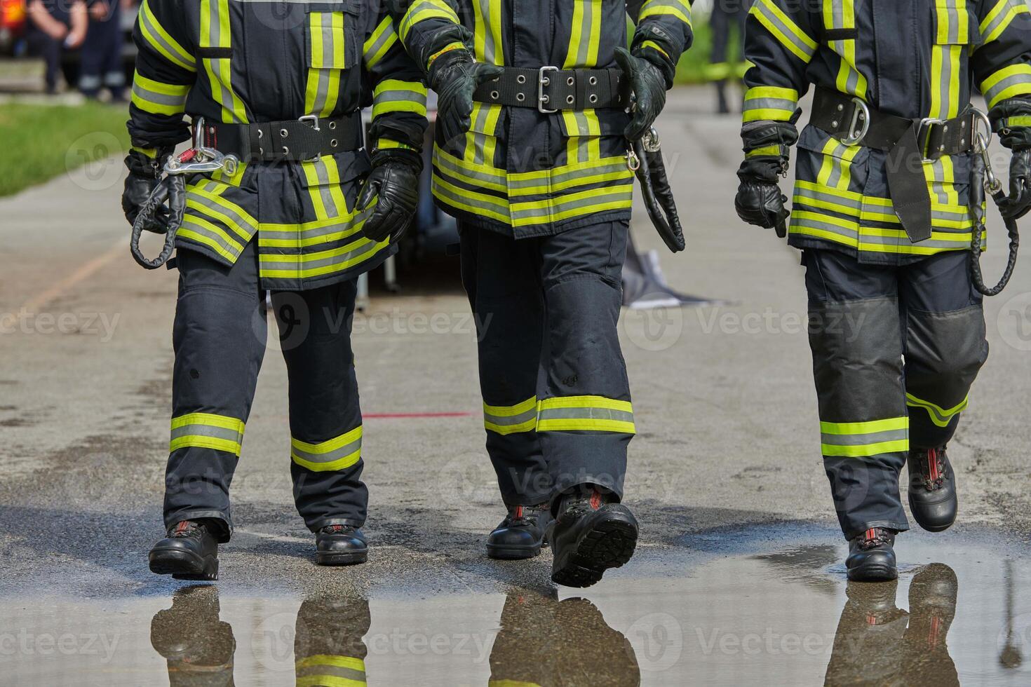 A team of confident and accomplished firefighters strides purposefully in their uniforms, exuding pride and satisfaction after successfully completing a challenging firefighting mission photo