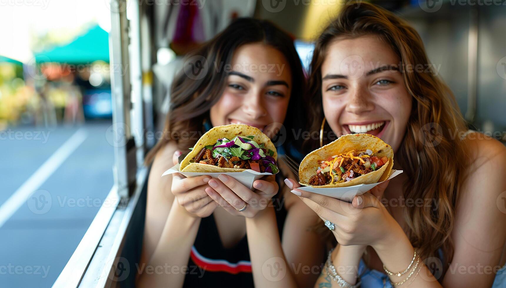 Two Beautiful Young Girls happy friends eating Mexican tacos, background with copy space, great for food small business, advertising service. photo