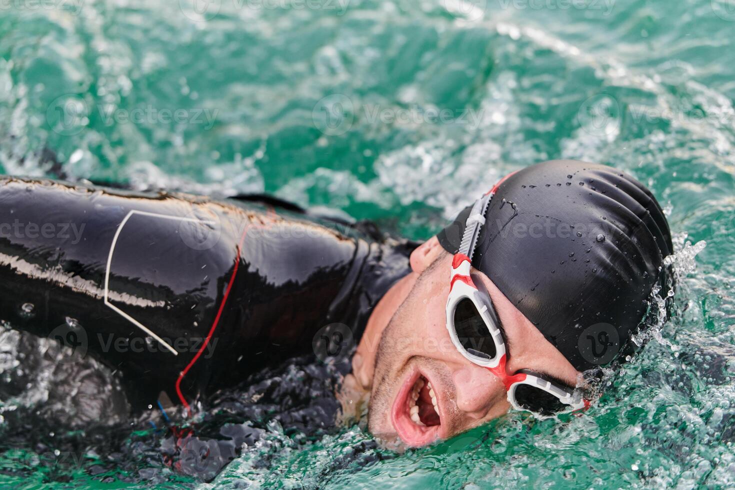 A professional triathlete trains with unwavering dedication for an upcoming competition at a lake, emanating a sense of athleticism and profound commitment to excellence. photo