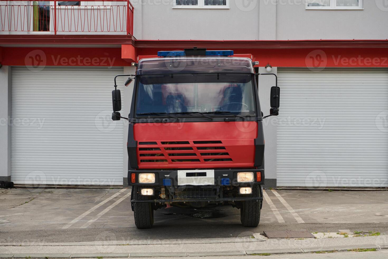 A state-of-the-art firetruck, equipped with advanced rescue technology, stands ready with its skilled firefighting team, prepared to intervene and respond rapidly to emergencies, ensuring the safety photo