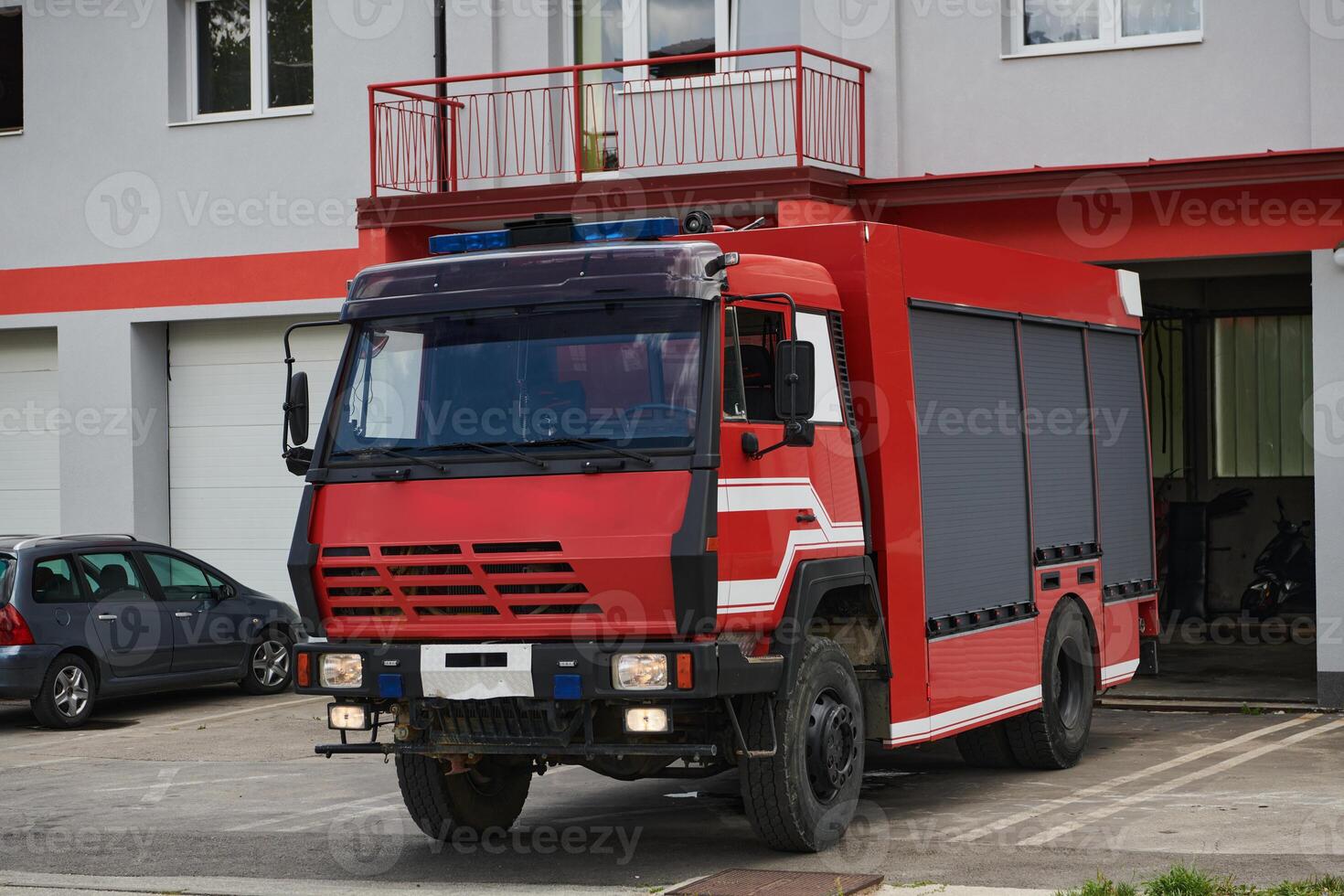A state-of-the-art firetruck, equipped with advanced rescue technology, stands ready with its skilled firefighting team, prepared to intervene and respond rapidly to emergencies, ensuring the safety photo