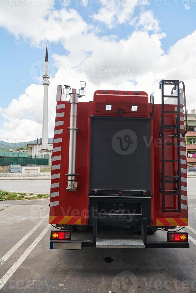 A state-of-the-art firetruck, equipped with advanced rescue technology, stands ready with its skilled firefighting team, prepared to intervene and respond rapidly to emergencies, ensuring the safety photo