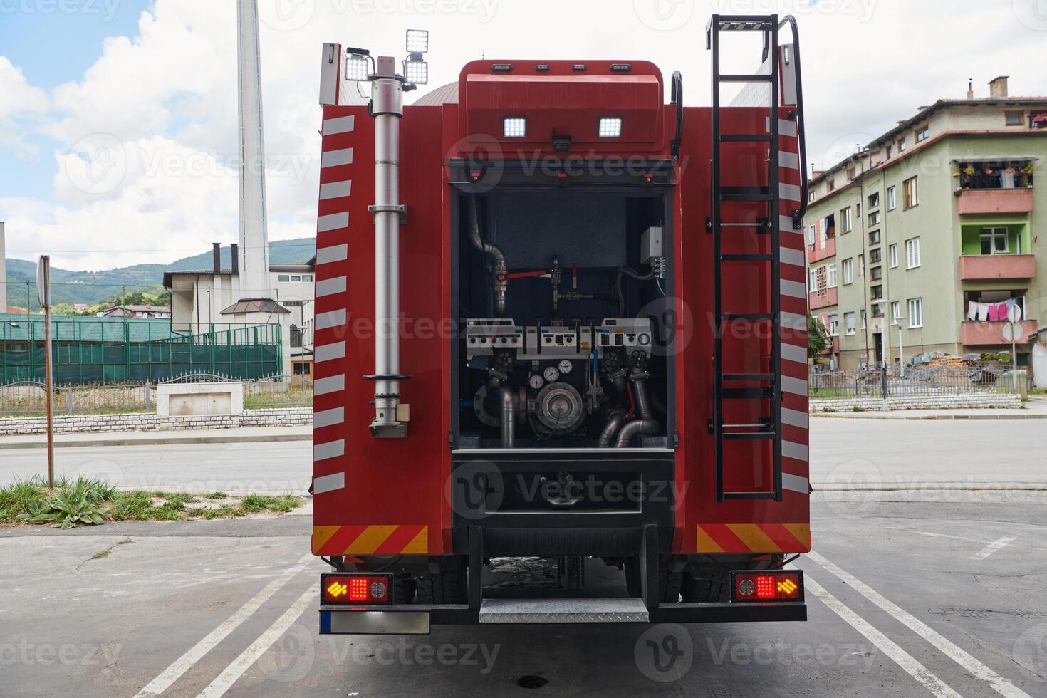 A state-of-the-art firetruck, equipped with advanced rescue technology, stands ready with its skilled firefighting team, prepared to intervene and respond rapidly to emergencies, ensuring the safety photo