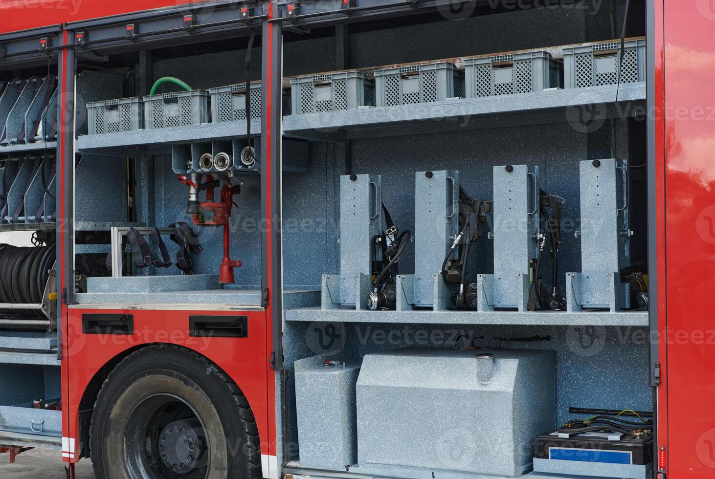 Close-up of essential firefighting equipment on a modern firetruck, showcasing tools and gear ready for emergency response to hazardous fire situations photo