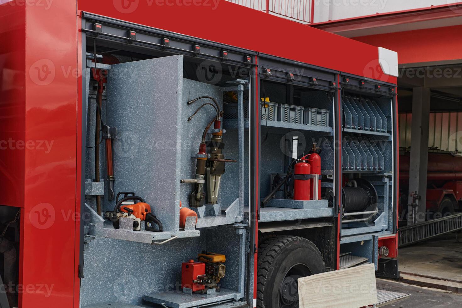 Close-up of essential firefighting equipment on a modern firetruck, showcasing tools and gear ready for emergency response to hazardous fire situations photo