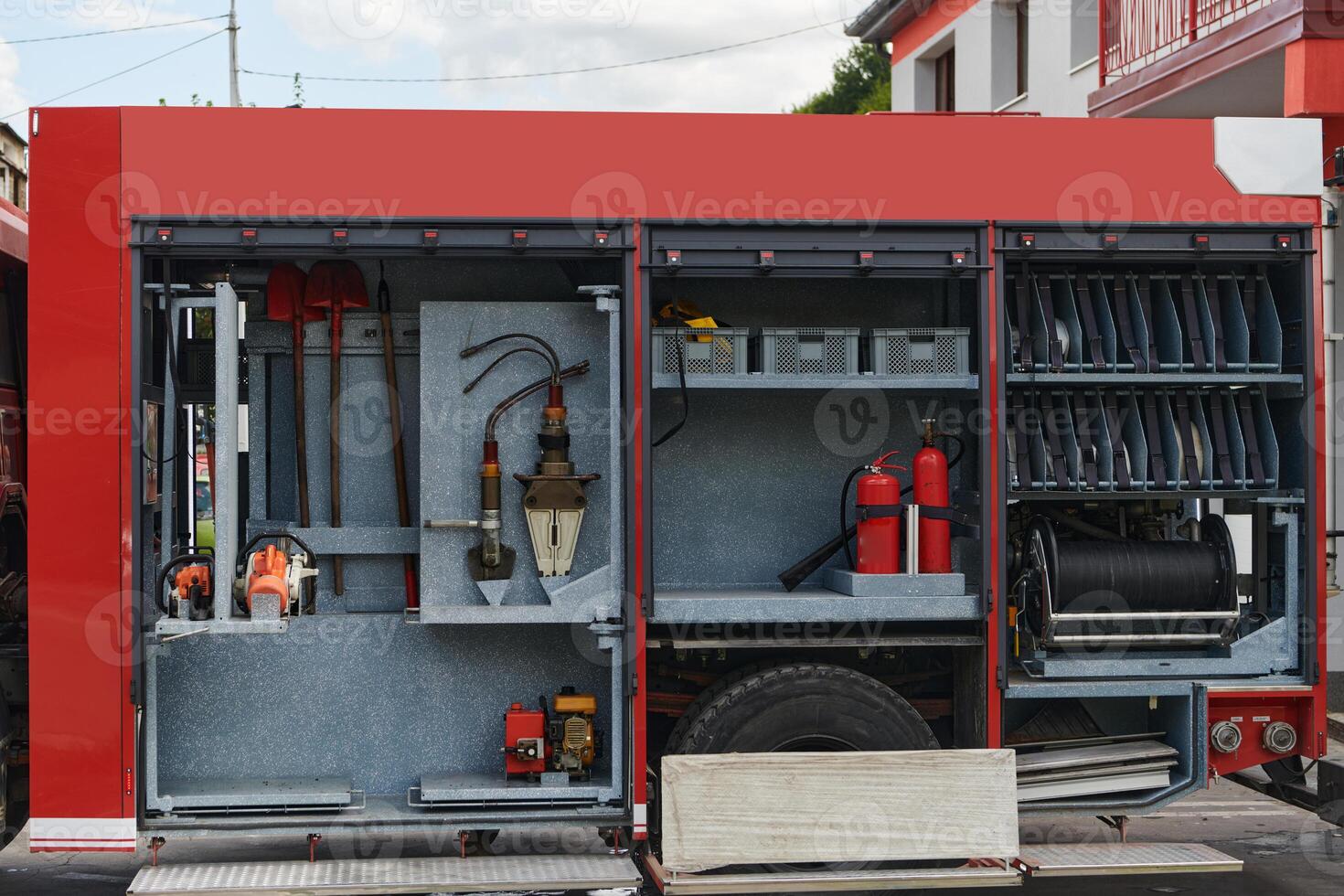 Close-up of essential firefighting equipment on a modern firetruck, showcasing tools and gear ready for emergency response to hazardous fire situations photo