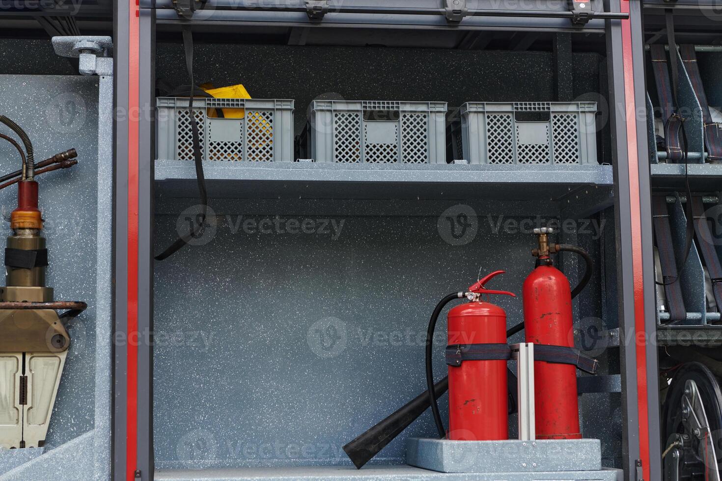 Close-up of essential firefighting equipment on a modern firetruck, showcasing tools and gear ready for emergency response to hazardous fire situations photo